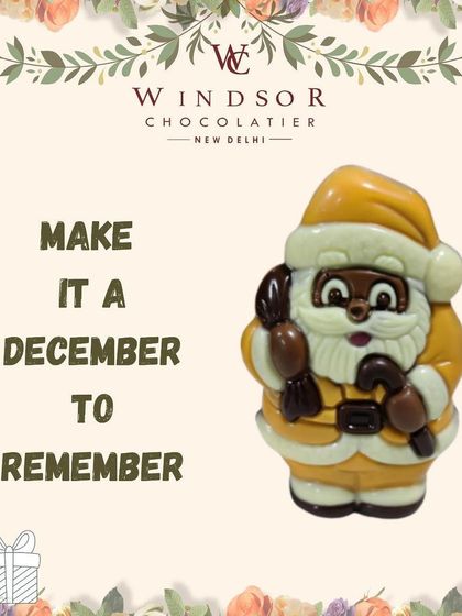 A close up of my white and yellow detailed Santa Claus figurine, made from a combination of white and dark chocolate to create a memorable character.
