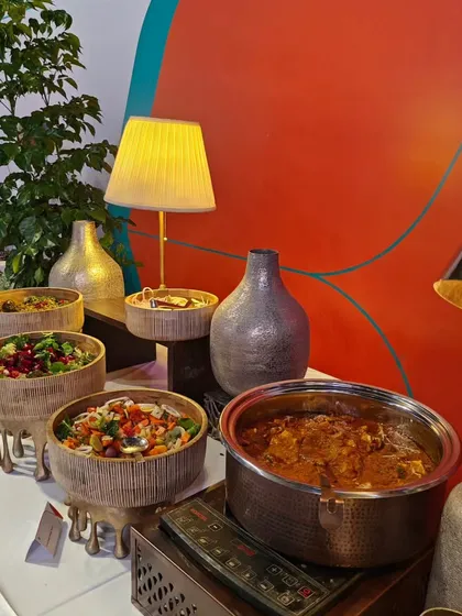 A selection of fresh salads and a hot main course displayed at the Air India X launch. Our menus for large corporate events are balanced, offering a variety of healthy and hearty options to suit all tastes.