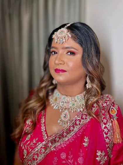 A side profile showing the pop of color on her eyes and lips, adding a festive touch to her Haldi look.
