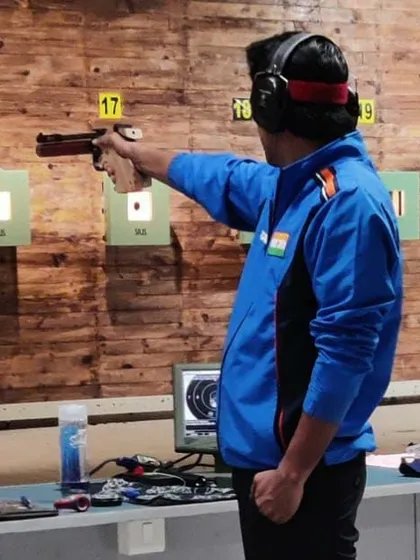 I believe in leading from the front. Here I am competing in the 10m Air Pistol event at the Karnataka State Meet, where I won a gold medal.