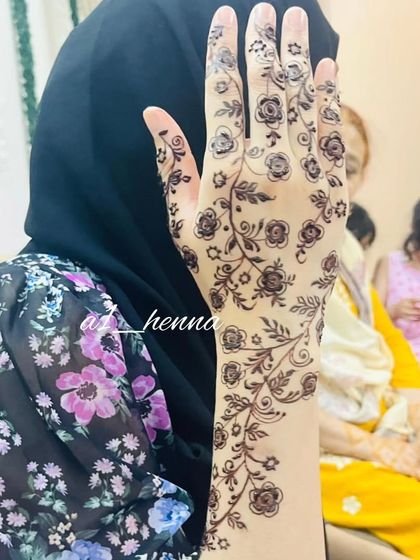 A close-up of the floral vine design, showing the fine details.