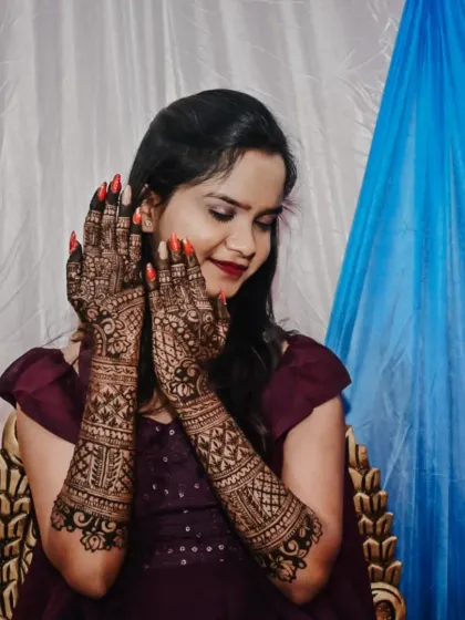 Seeing my bride happy with her engagement mehendi is the best feeling. This design covers both arms with dense, traditional patterns, perfect for such a special ceremony.