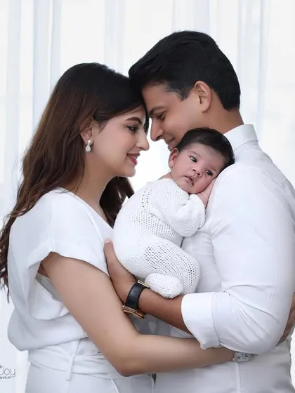 The first family portrait. These lifestyle moments are so precious, capturing the connection between mom, dad, and their new baby in a natural and heartfelt way. These sessions are relaxed and focus on your family's love.