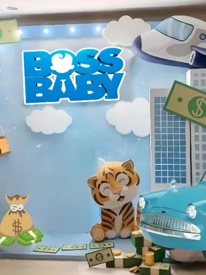 The complete setup for a fun Boss Baby party. The backdrop includes a city skyline, an airplane, and a vintage car, with plenty of fun props for photos.