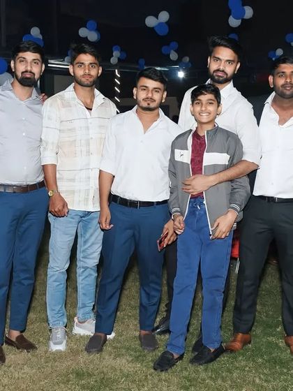 A group photo with my brothers and friends at a party.