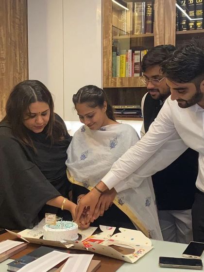 A moment of celebration with my team. Teamwork and a willingness to learn are the cornerstones of a successful legal practice.