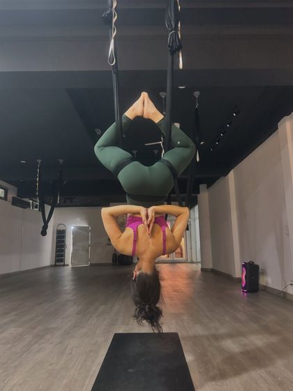 An inverted prayer pose, combining the benefits of an inversion with a moment of gratitude and inner focus.