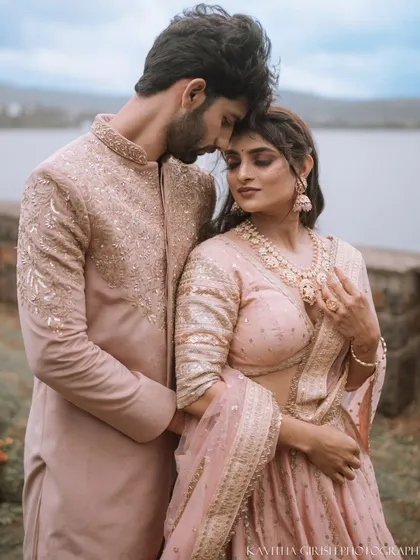 An intimate close-up from a couple's portrait session, highlighting their elegant traditional attire and the quiet connection between them. These moments are timeless.