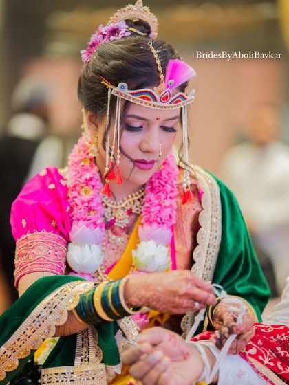 A candid shot during the wedding rituals. The makeup is waterproof and long-lasting, ensuring the bride looks perfect throughout the emotional and happy moments of her big day.