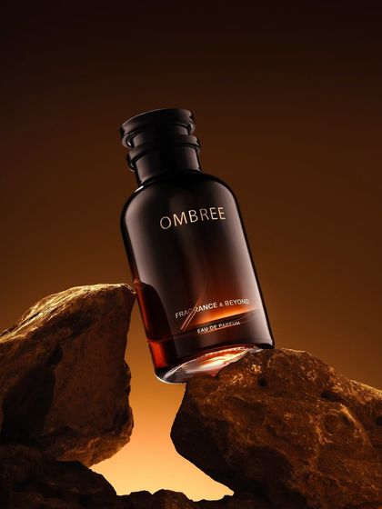 We placed this "Ombree" perfume bottle on rugged rocks with warm backlighting to evoke a sense of earthy, masculine strength and warmth.
