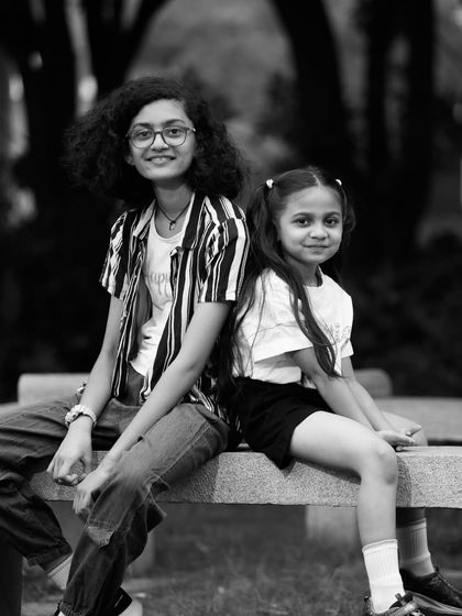 Another take from the sisters' photoshoot, this black and white image captures a slightly different pose and expression.