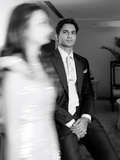 I use creative techniques like motion blur to add a dynamic, artistic feel to my portraits. This shot focuses on the groom, with the bride's movement creating a sense of energy and story.