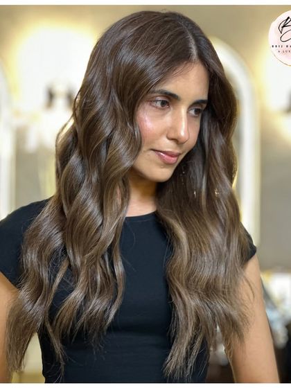 The client looking elegant and chic with her new Cool Chestnut Drift hair color.