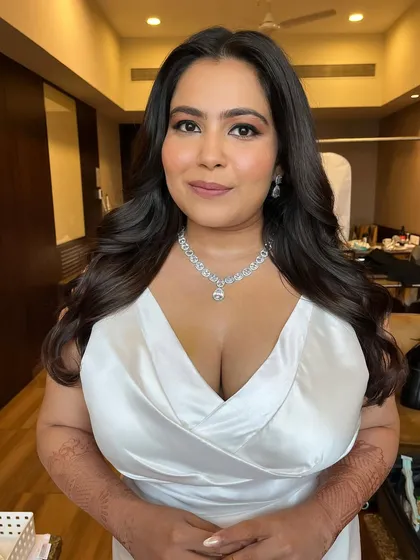 A confident and classic pose. The makeup is perfectly balanced, creating a look that is both modern and timelessly elegant.