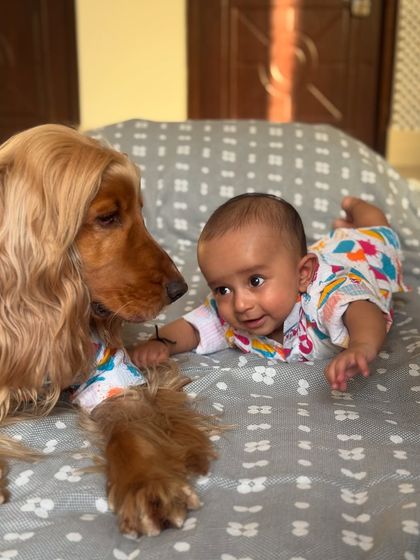 A tender moment between the two brothers on Holi, sharing a look of pure love and innocence.