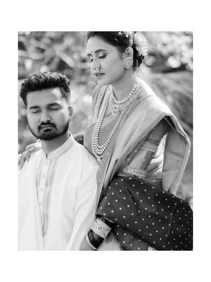 A quiet, artistic portrait of Vicky and Aishwarya. The black and white tones and their serene expressions create a moment of calm and connection, a beautiful contrast to the day's festivities.