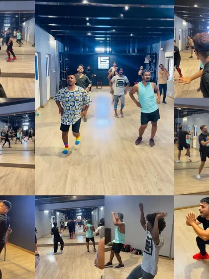 This collage provides a 360-degree view of a workshop in progress. You can see participants spread out across the floor, fully immersed in the session.