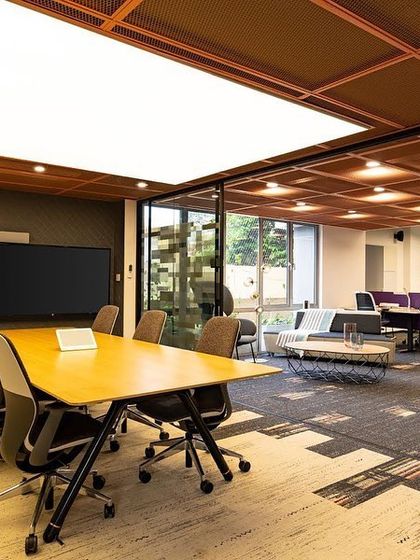 Video conferencing requires specific lighting. In this conference room, I installed a large, luminous ceiling panel directly over the table. This provides soft, even, and flattering facial illumination, ensuring everyone looks their best on camera.