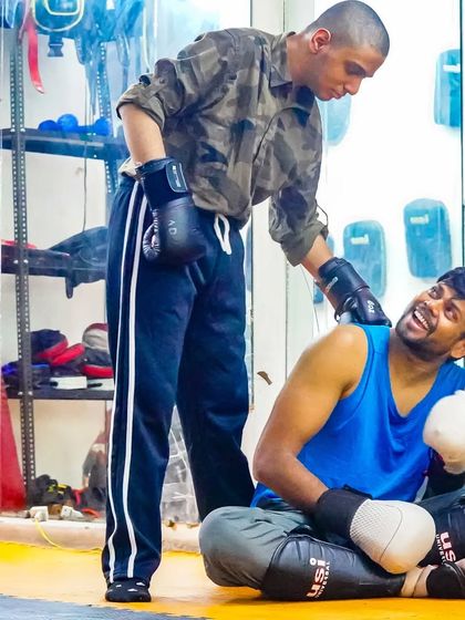 Even our coaches get in on the fun. A lighthearted moment between a coach and a member shows the friendly and supportive atmosphere I cultivate in all my classes.