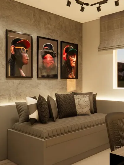 A close-up of the daybed area, featuring trendy art prints and a comfortable setup for relaxing.