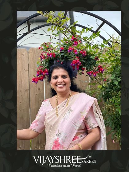 Our client Sapna in a beautiful brocade Kanjivaram with a floral border, inspired by Sabyasachi's designs.