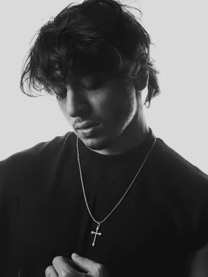 A black and white portrait showing a moment of reflection. These shots add depth and personality to my press portfolio.