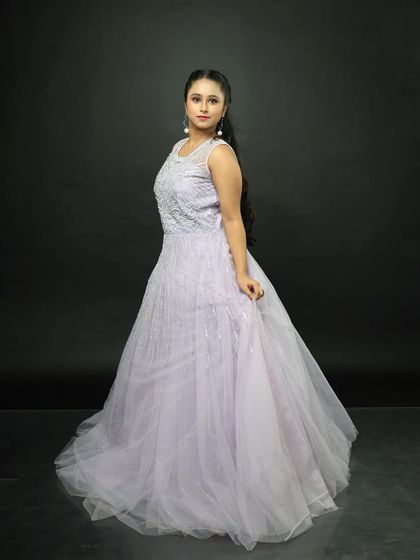 The gown from the side, showing its elegant profile and the way the tulle skirt falls.