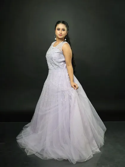 The gown from the side, showing its elegant profile and the way the tulle skirt falls.