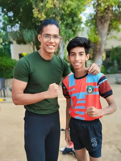 Our best junior raider, Sachin, with a senior player. We believe in mentoring our young talent to help them reach their full potential.