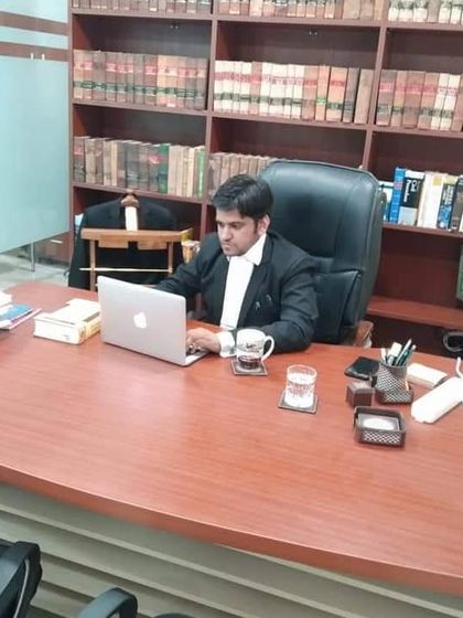 Working late in the office. The practice of law is demanding, but the pursuit of justice is always worth the effort.