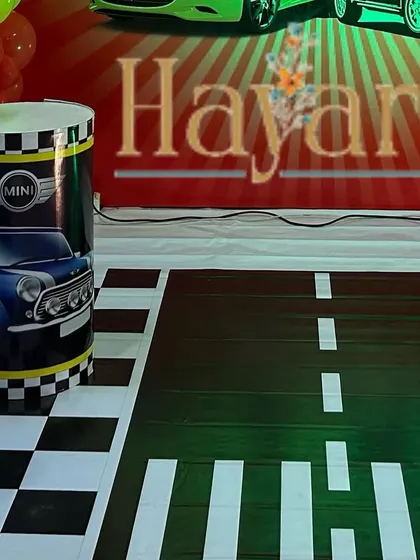 A custom floor mat designed to look like a road, adding to the immersive feel of the car theme.