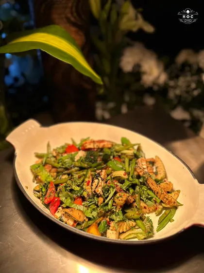 A colourful and healthy stir-fry, showcasing a mix of fresh vegetables like broccoli, baby corn, and bell peppers, all tossed in a light and flavourful sauce.