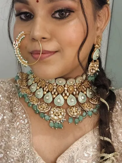A close-up of the mint green kundan and pearl jewellery set. This type of statement jewellery is available to rent with any of our outfits.