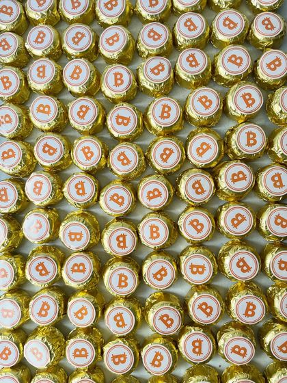 The only crypto you can unwrap and enjoy! These fun, custom-wrapped chocolates with a Bitcoin logo were created for a corporate fintech event.