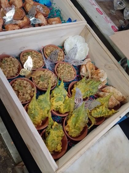 Another view of our platter box, this one showcasing our Palak Patta Chaat and Chana Masala. These boxes are a convenient way to enjoy our gourmet food at home.