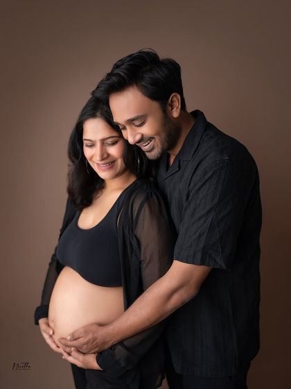 A joyful couple's portrait from a studio maternity shoot. The genuine smiles and laughter are always my favorite to capture.