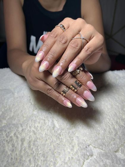 A soft ombre from a nude base to a milky white tip. This is a subtle and very natural-looking enhancement.