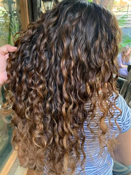 Another view of the curly mermaid hair, showing how the color enhances the beautiful texture.
