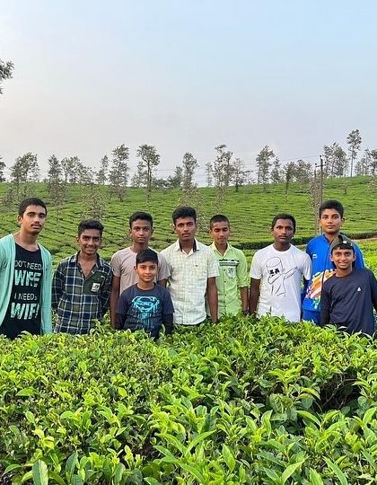 A group of boys from the KRIES camp enjoys the scenic beauty of the tea plantations in Barapole.