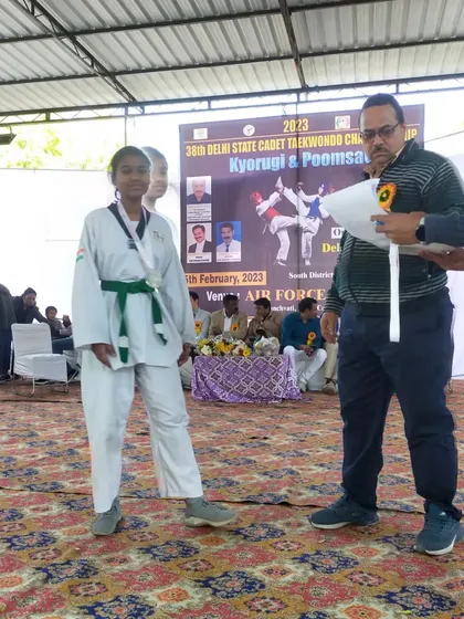 Anishka receiving her certificate and medal at the 38th Delhi State Cadet Championship.