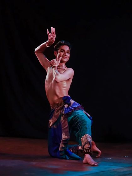 A kneeling pose from the Samarpan festival, combining grace with strength. My solo performances feature a wide range of movements, from powerful jumps to grounded, expressive postures.