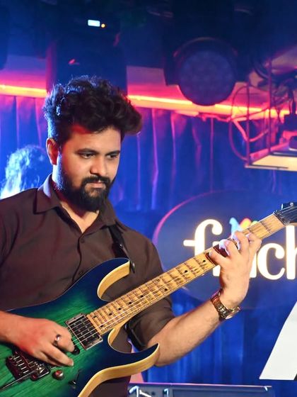 Our instructors are not just teachers but also active performers. This shot captures one of our guitar gurus during a live performance, bringing real-world experience and passion into every lesson they teach.