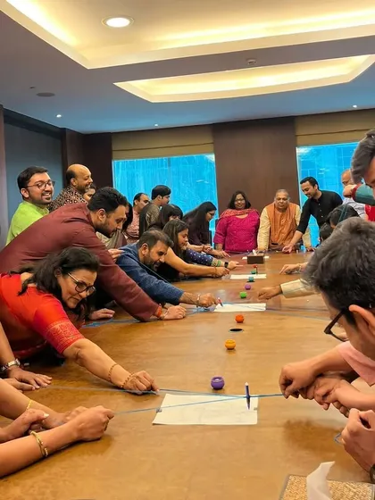 Team building should be fun, not forced. Here, the team at ICICI Venture is fully focused on a custom-designed game during their Diwali party. I bring in activities that encourage genuine interaction and teamwork, creating bonds that last beyond the event.