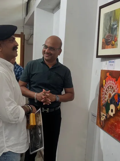 Explaining the concept behind one of my abstract paintings to Shri Ajay Purkar.