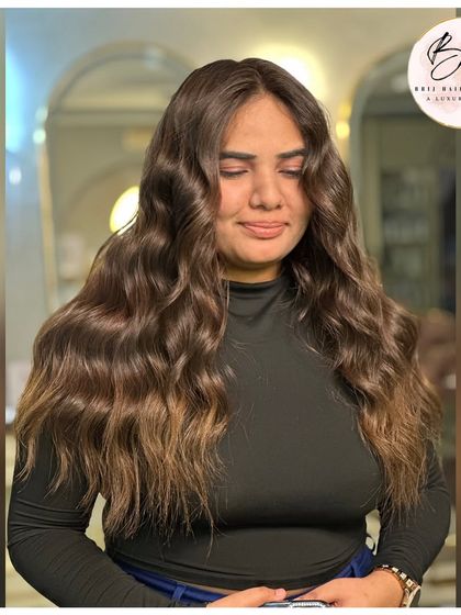 The client looking serene and confident with her new, aura-upgrading hair color.