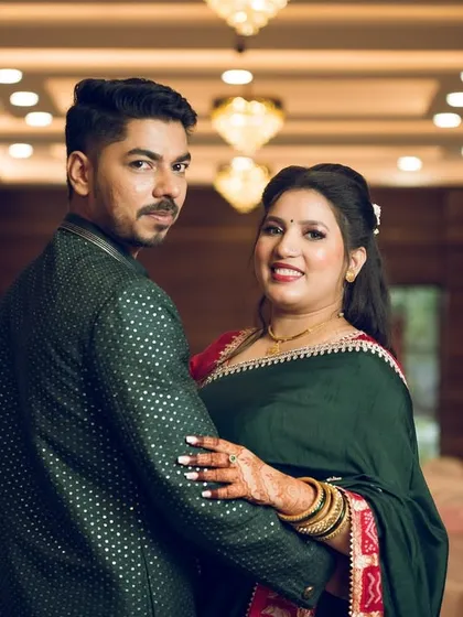 A playful over-the-shoulder look from the couple, adding a dynamic and fun shot to their engagement photo collection.