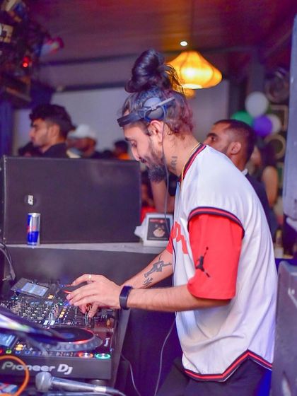 Deep in concentration, mixing tracks during a high-energy set. This is where focus, dedication, and practice come together.
