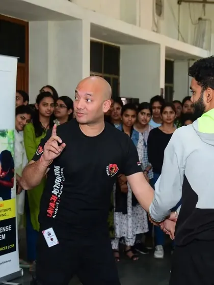 I am explaining a technique to a student volunteer during the workshop at CCS University.