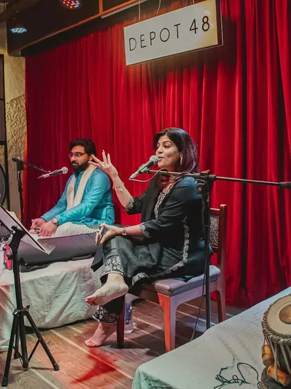 A candid moment of interaction with the vocalist during the performance.