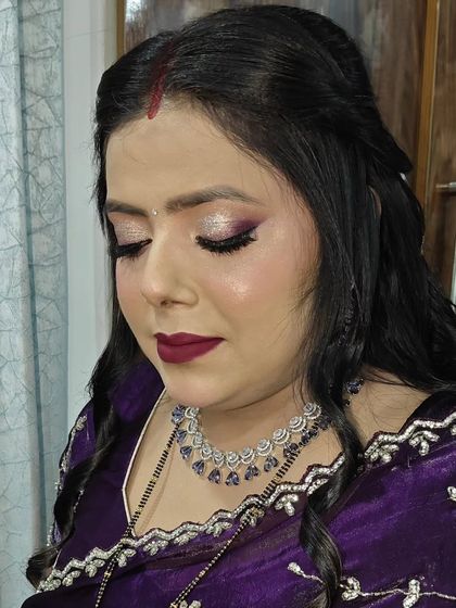 A close-up of the purple glittery eye makeup. I love how the shimmer catches the light and adds so much dimension.